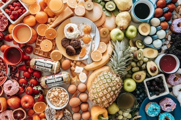 Grazing spread of fruit, pastries and snacks
